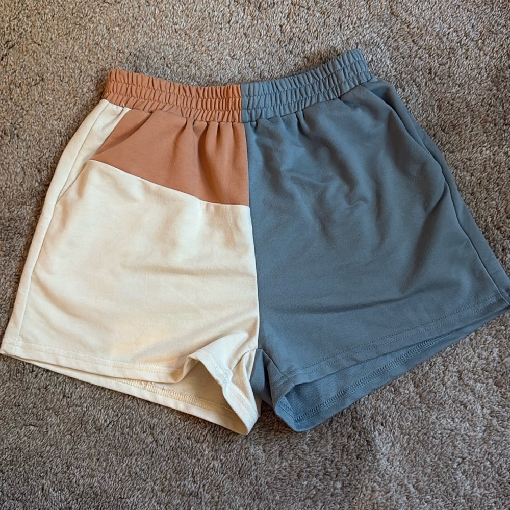Cream, terracotta, and blue shorts